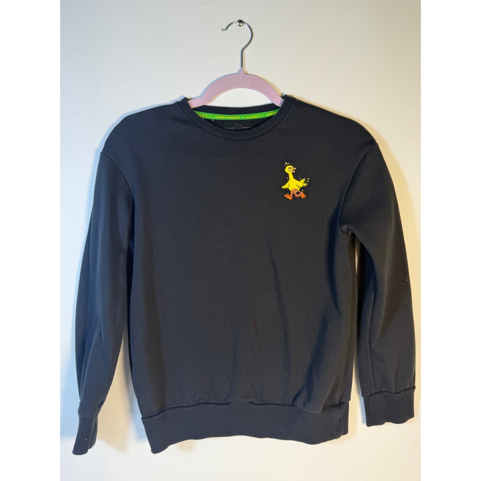 Under Armour Curry Sesame Street Big Bird youth sweatshirt in black, featuring Big Bird design, for boys and men.