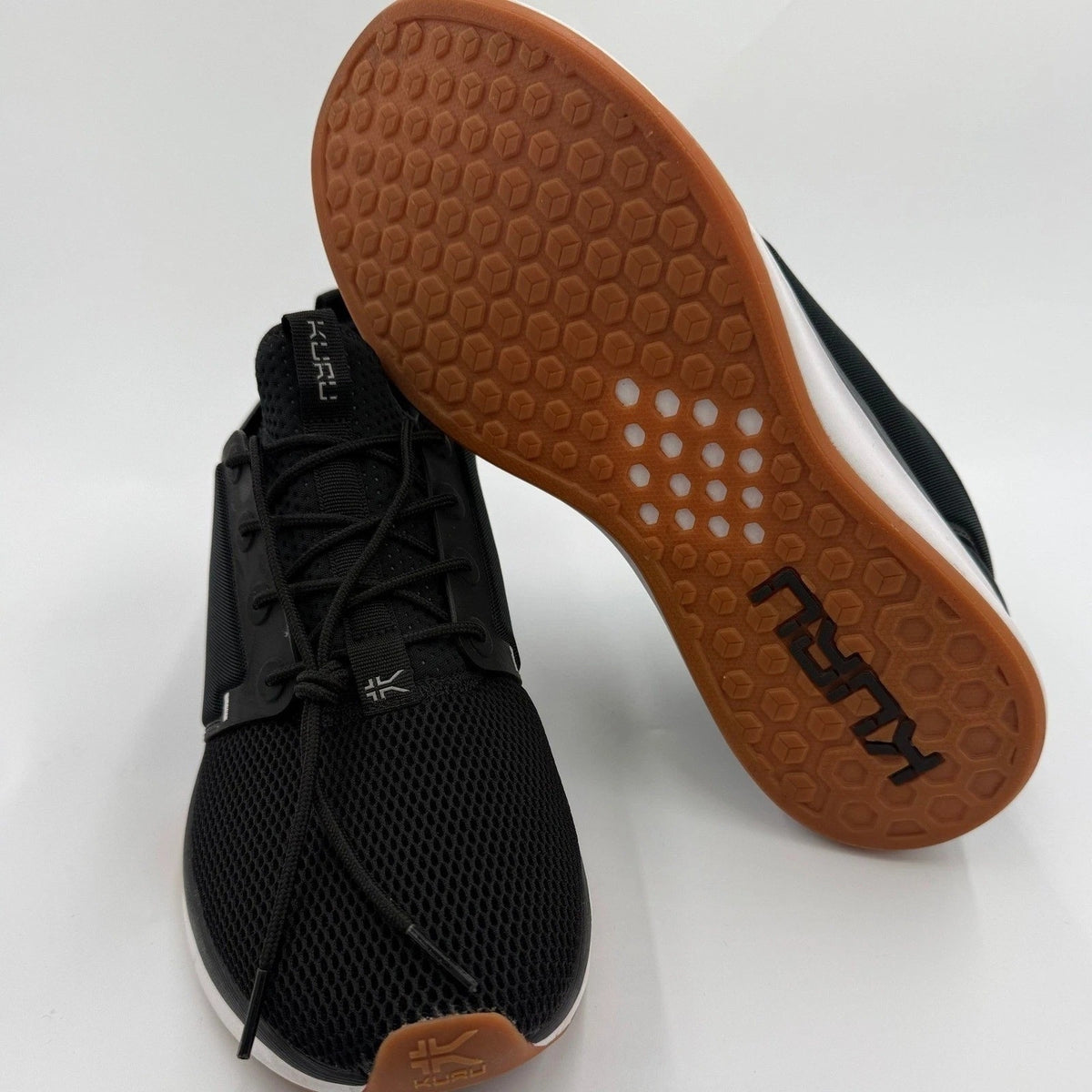 KURU ATOM Women's 12 Jet Black White Gum supportive walking sneakers with cushioned soles and breathable mesh upper.
