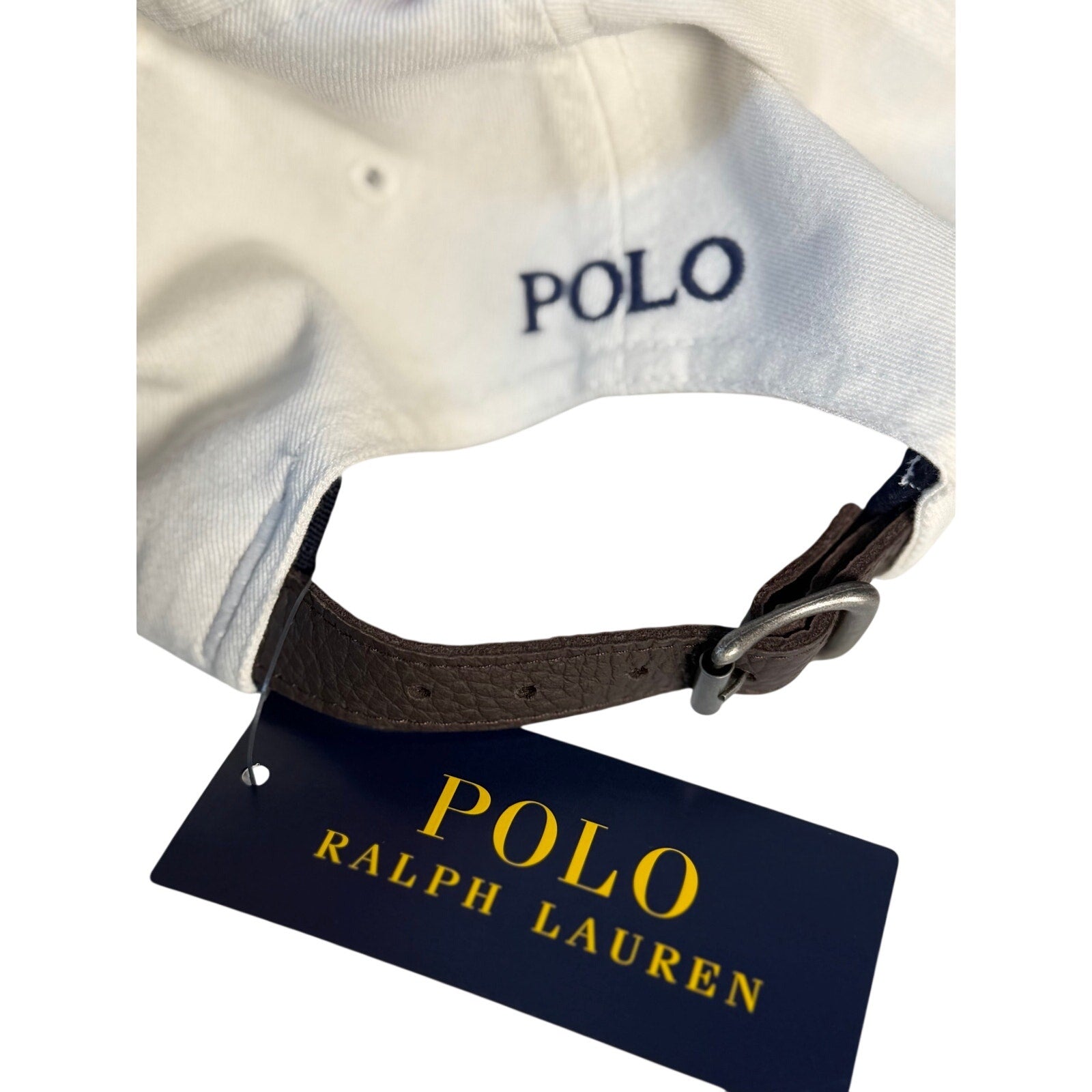 White Polo Ralph Lauren baseball cap with 20th Anniversary Big Pony logo, adjustable strap, front view.