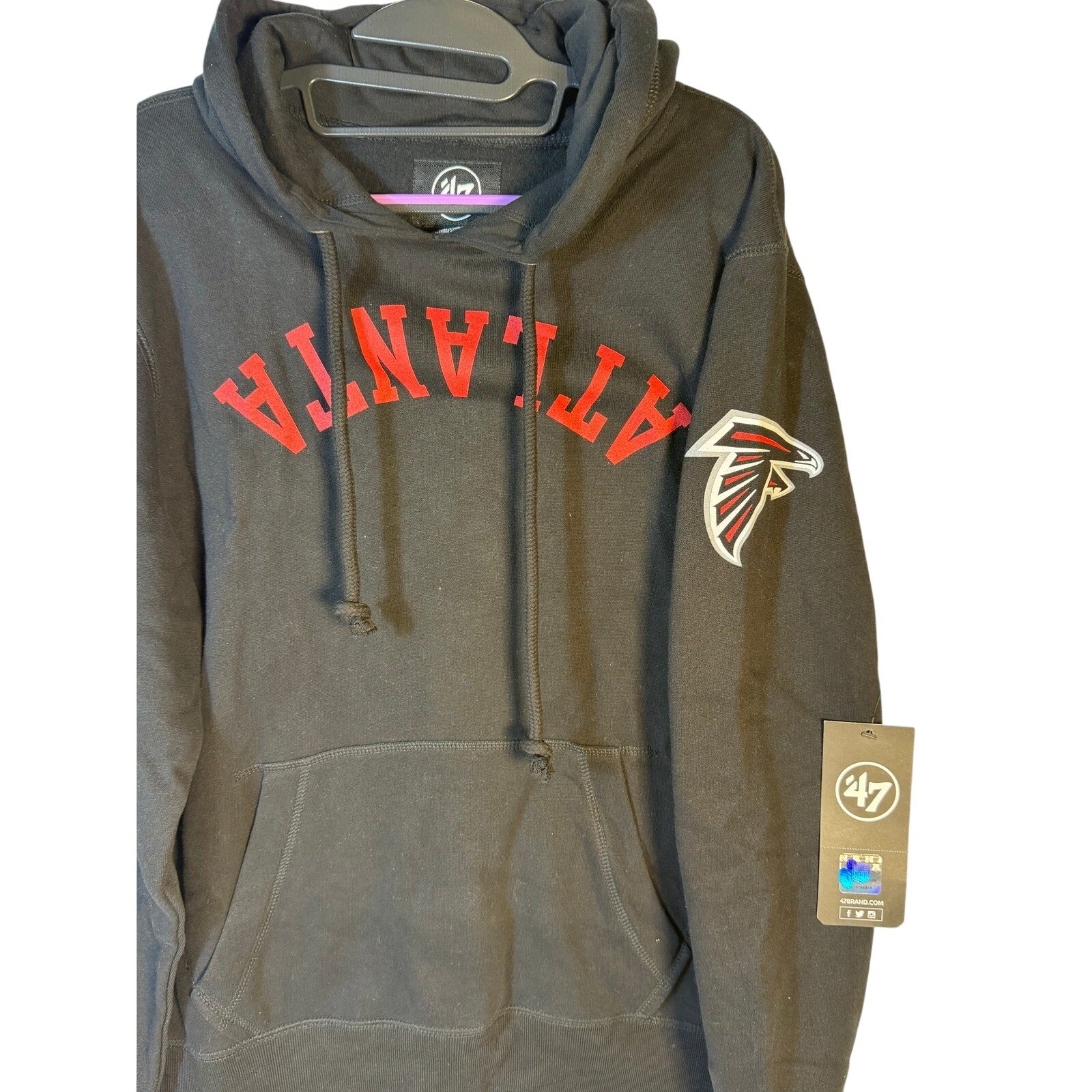 Black men's 47 Brand Atlanta Falcons hoodie, NFL fleece pullover with hood, small size, featuring team logo and design details.