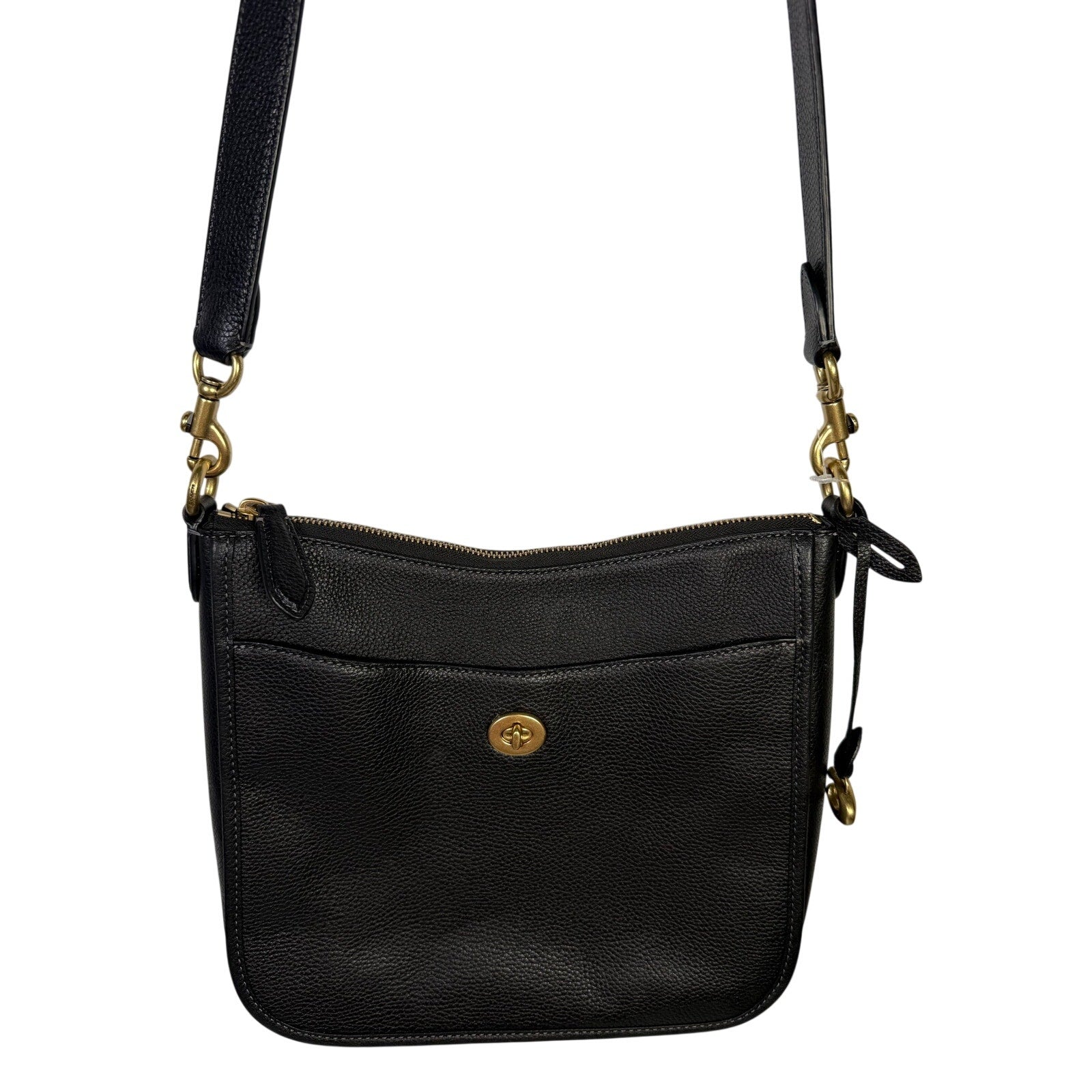 Black pebbled leather Coach handbag with gold-tone hardware, crossbody shoulder bag for women.