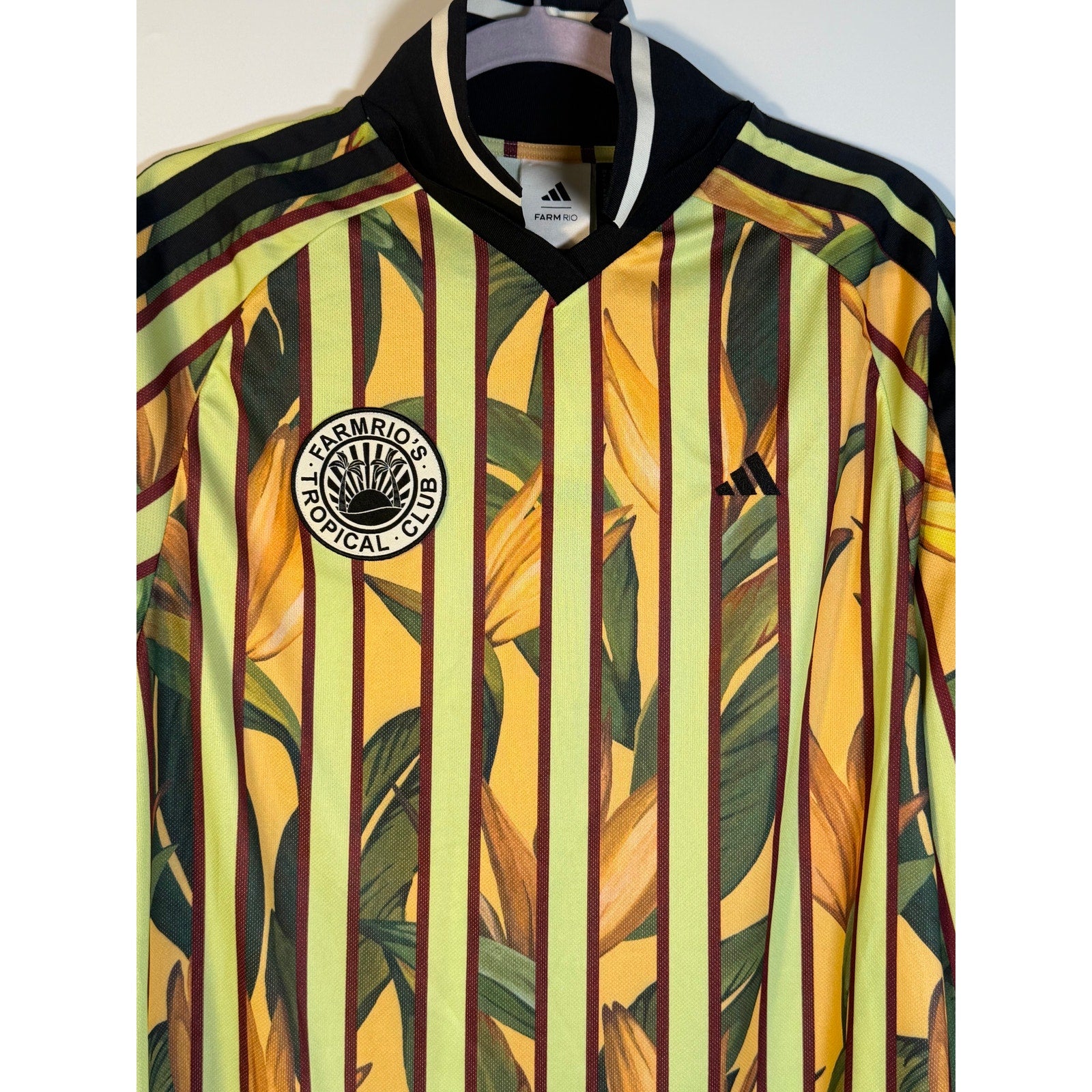 Adidas x Farm Rio women's premium jersey dress in size medium, featuring colorful floral patterns and a comfortable fit.
