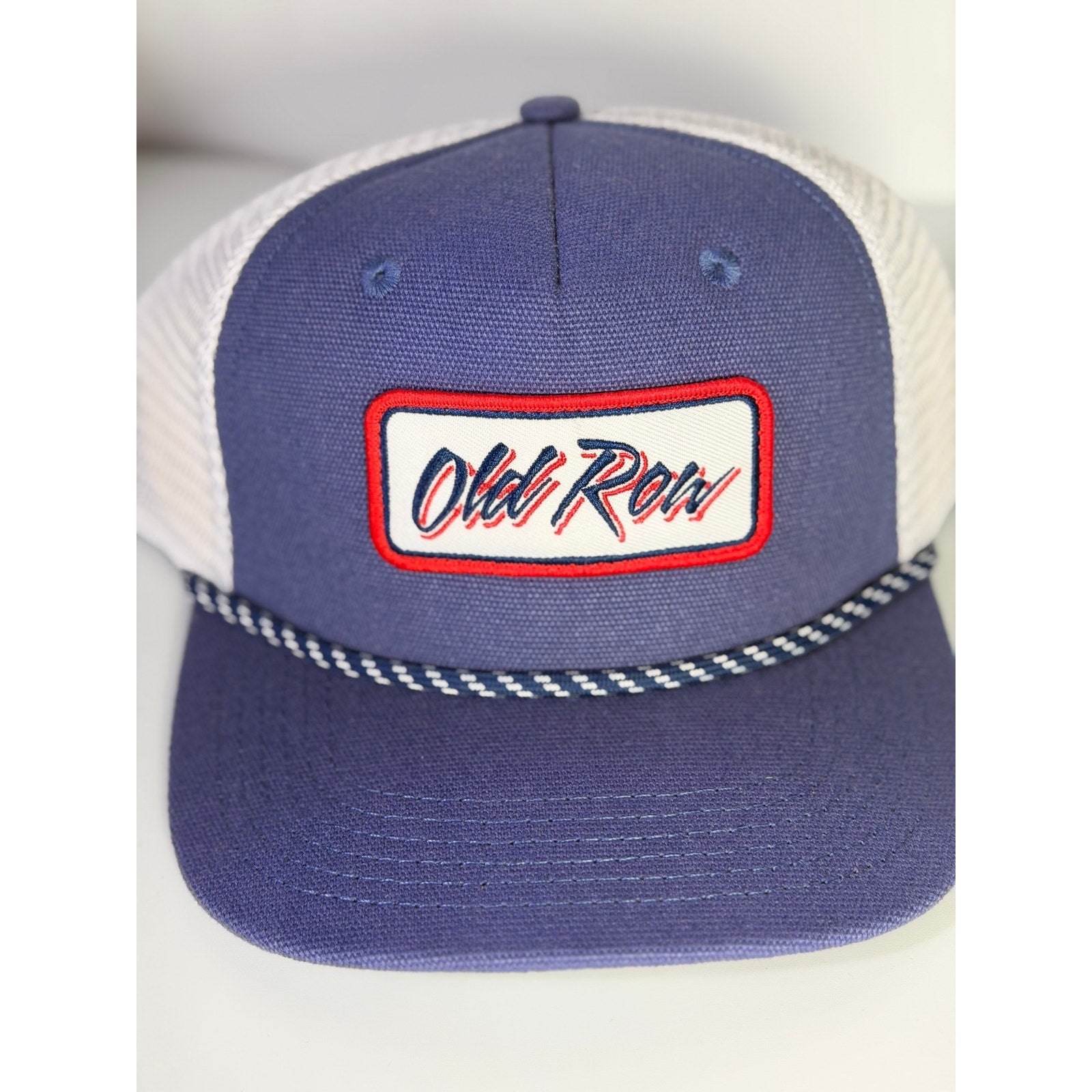 Old Row navy and white mesh trucker hat with rope detail and snapback closure, adult one size, new with tags.