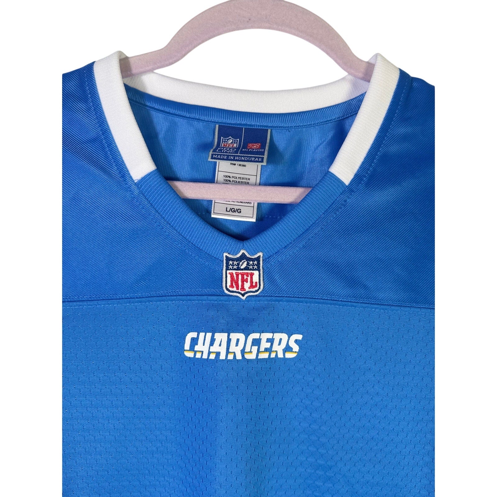 NFL Players women's Los Angeles Chargers blue football jersey, size L, new with tags, featuring team logo and athletic fit.