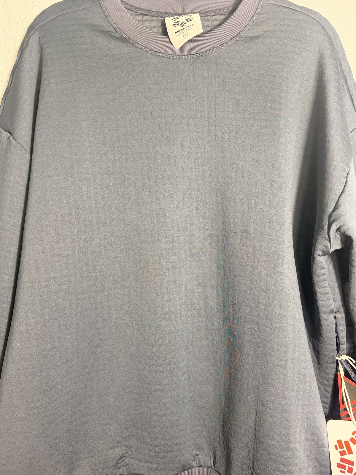 Men's Obermeyer Explorer Tech Crew Pullover in Blue Nights, medium size, showing the comfortable crewneck design and soft fabric.