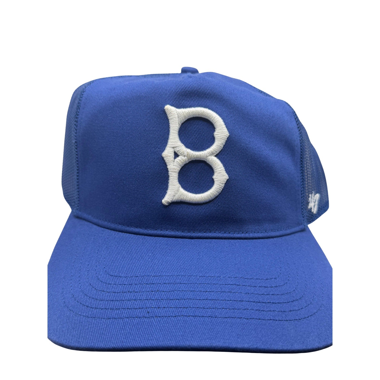 Blue '47 Brand Brooklyn Dodgers trucker hat with mesh panels and snapback closure, featuring the Dodgers logo on front.