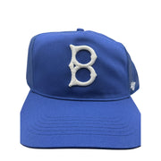 Blue '47 Brand Brooklyn Dodgers trucker hat with mesh panels and snapback closure, featuring the Dodgers logo on front.