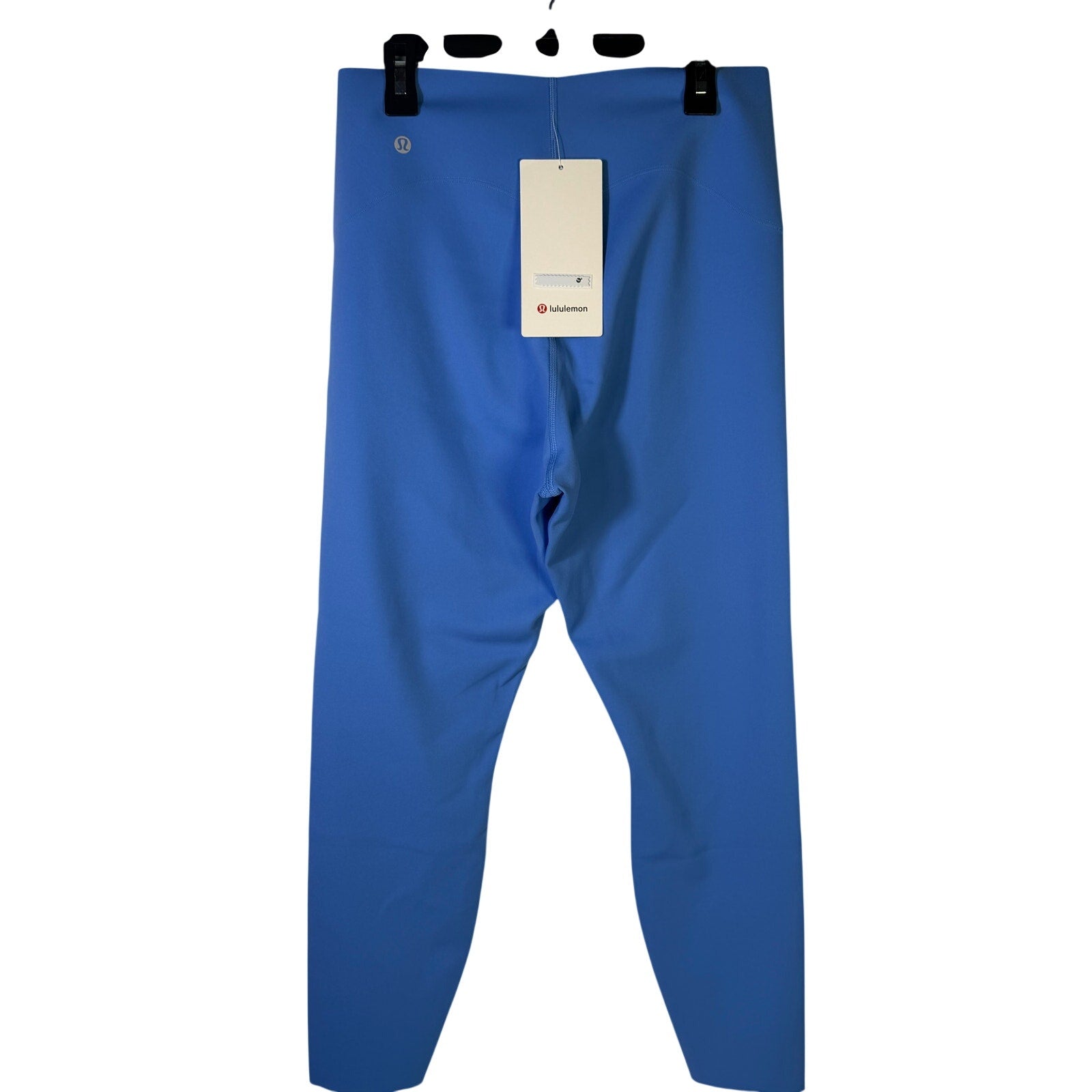 Lululemon Glow Up high-rise leggings in Pool Party Blue, size 10, with a close-up of the 25-inch length and smooth fabric.