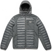 Black Merrell men's quilted hooded jacket with lightweight polyester fabric, shown in a stylish outdoor setting.