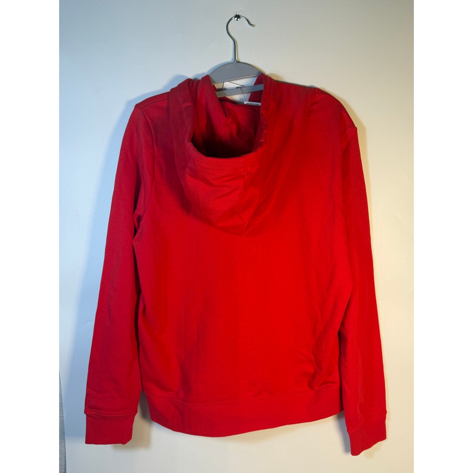 Red Nike Sportswear Club Fleece hoodie for women, medium size, featuring a cozy pullover sweatshirt with Nike branding.
