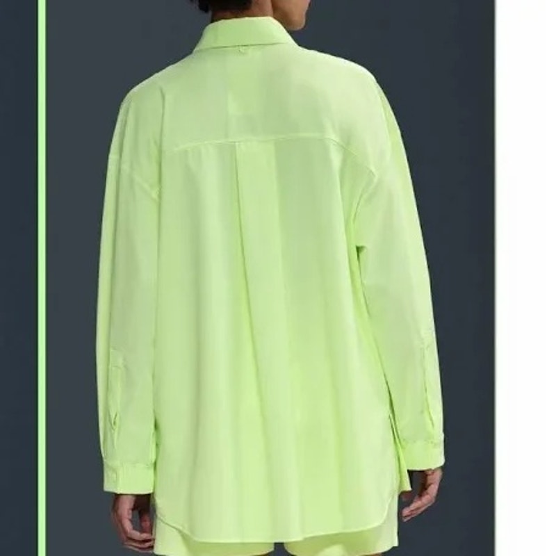 Nike 24.7 Women's New Venture oversized neon yellow long sleeve button-up shirt, casual tops with front buttons and collar.