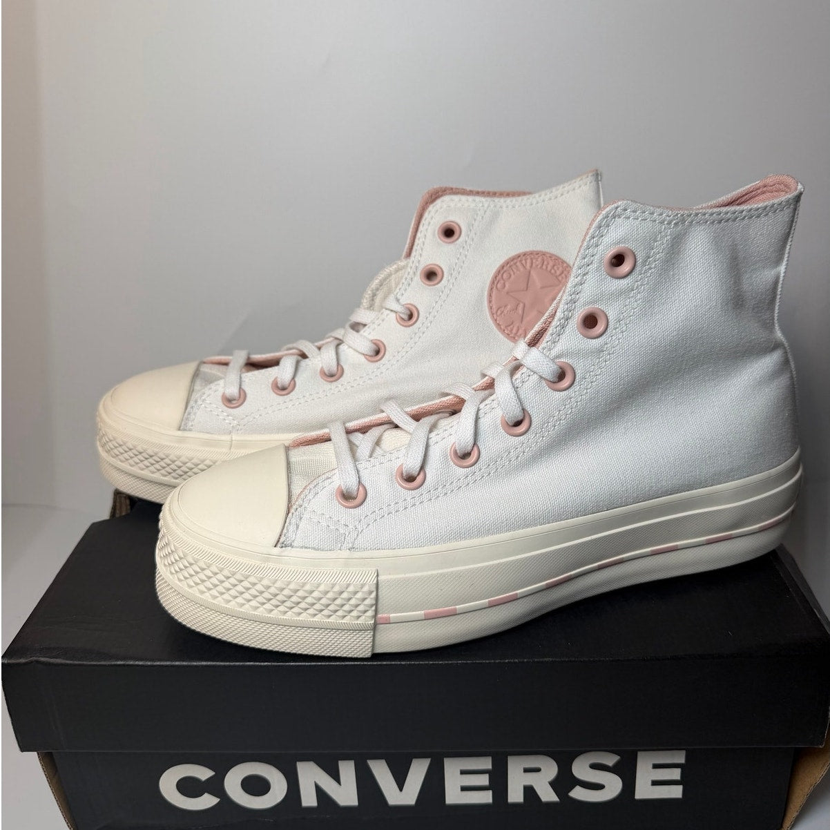Converse Chuck Taylor All Star Lift High sneakers in white with pink clay accents, women's size 7.5, casual footwear for women.