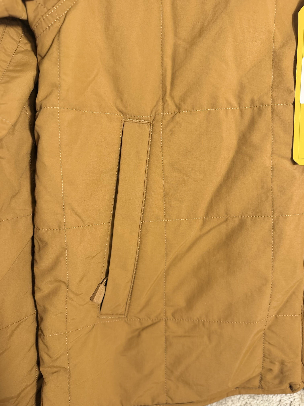 Carhartt Rain Defender loose fit quilted sherpa-lined women's jacket in brown, size medium, shown with hood and quilted interior.