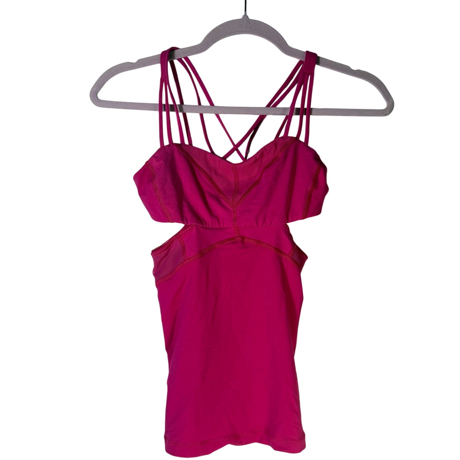 Lululemon women's magenta strappy cutout athletic tank top, size 2, pre-owned, with sporty design and breathable fabric.