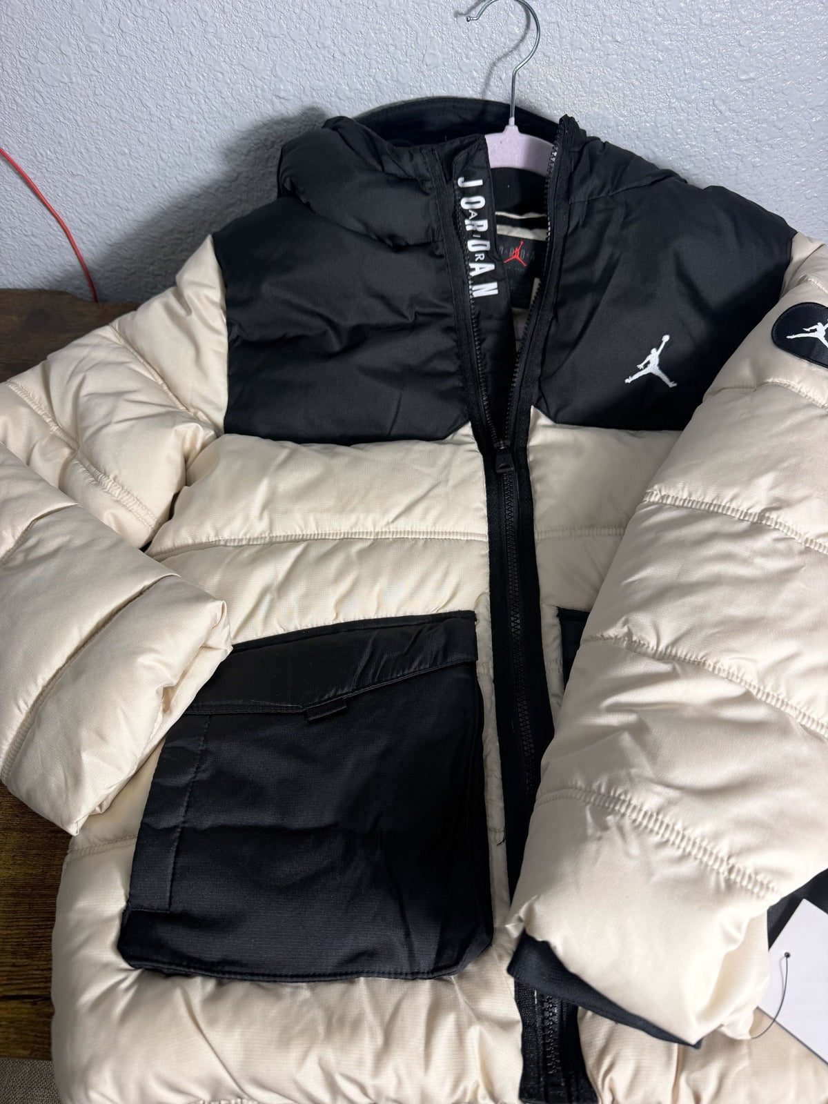 Jordan Jumpman hooded puffer jacket for boys in Legend Light Brown and Black, featuring a padded design and front zipper.