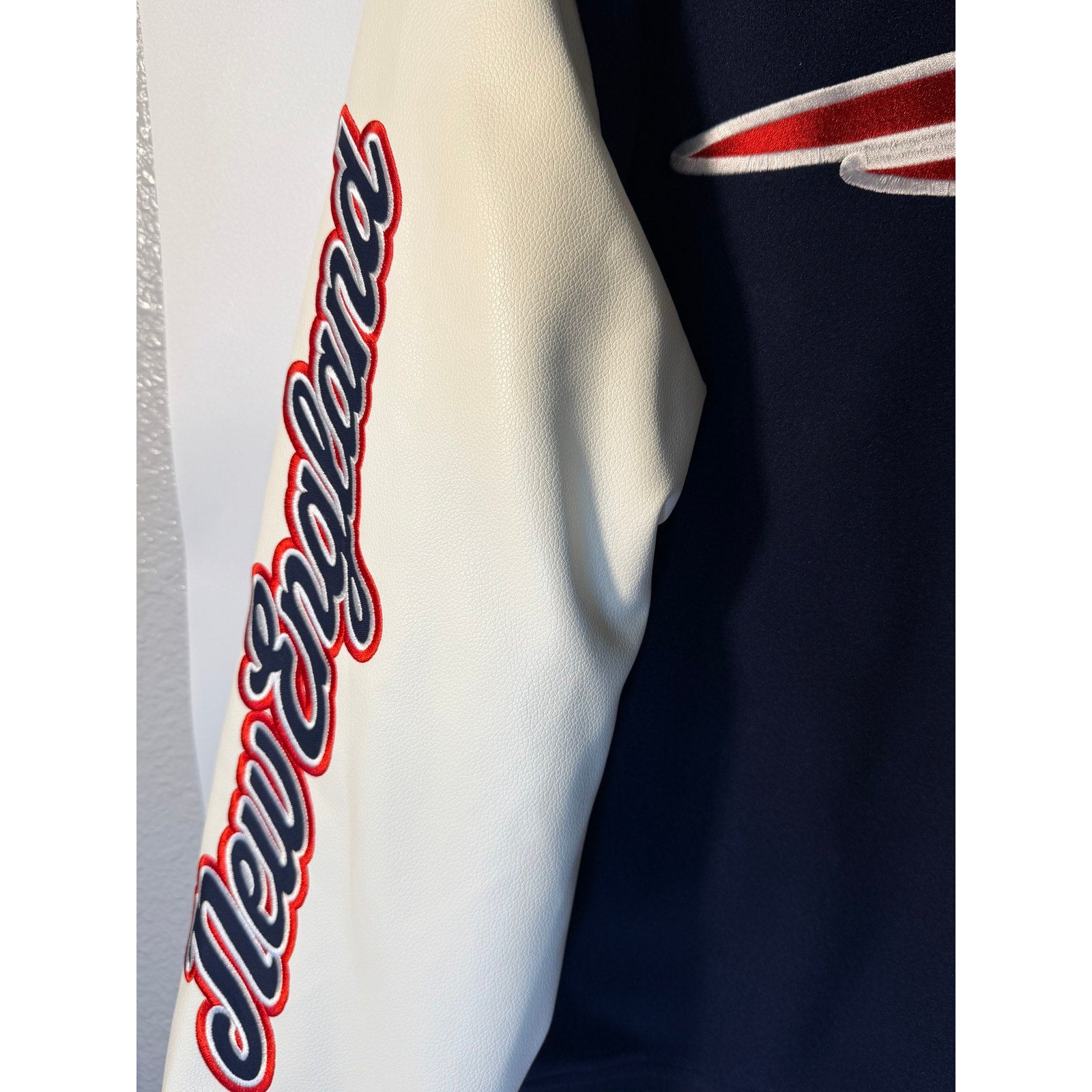 New England Patriots women's varsity hoodie in blue and white with embroidered team logo, faux leather accents, size XL.