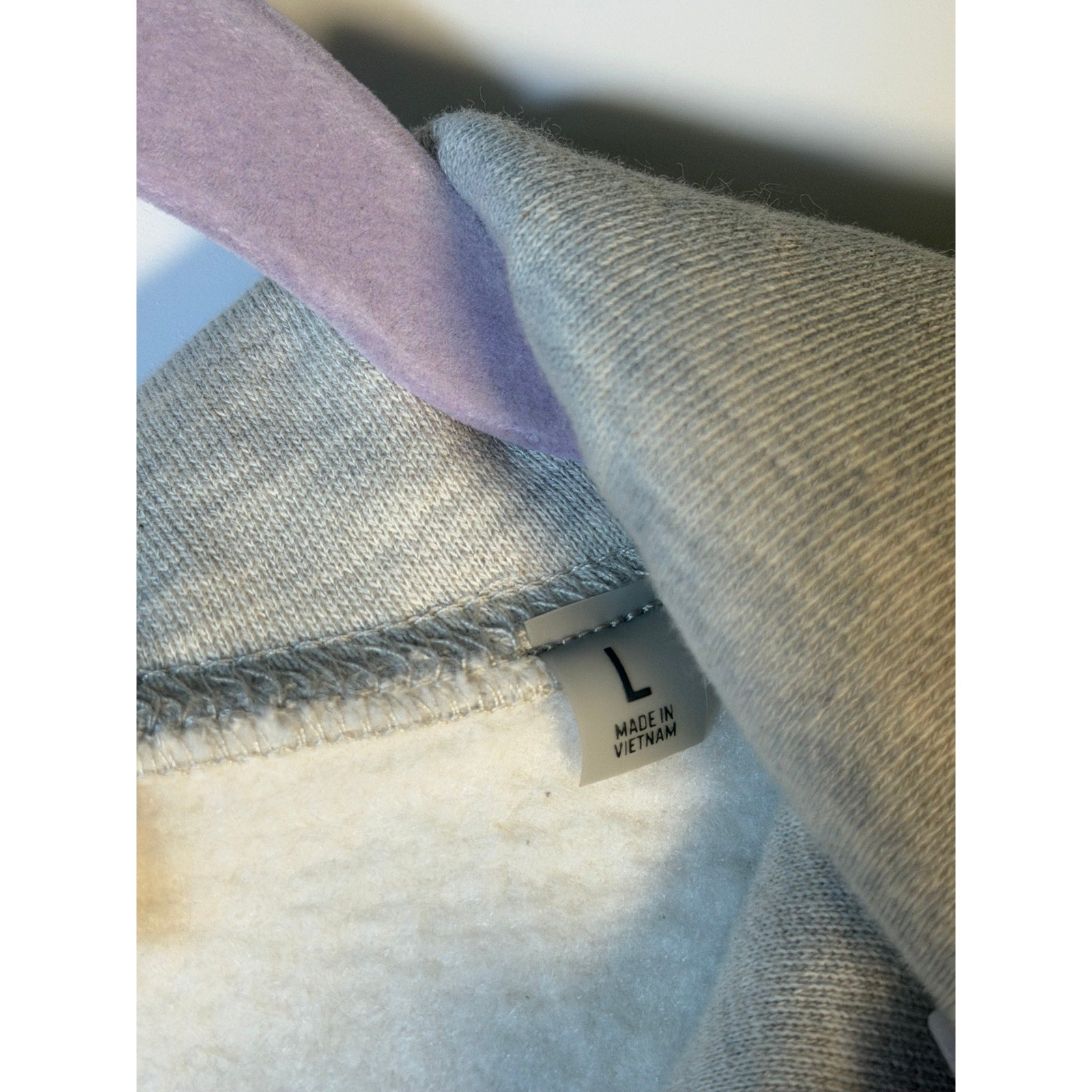 Fear of God ESSENTIALS men's light oatmeal pullover hoodie with logo, soft sweatshirt, front view, casual style.