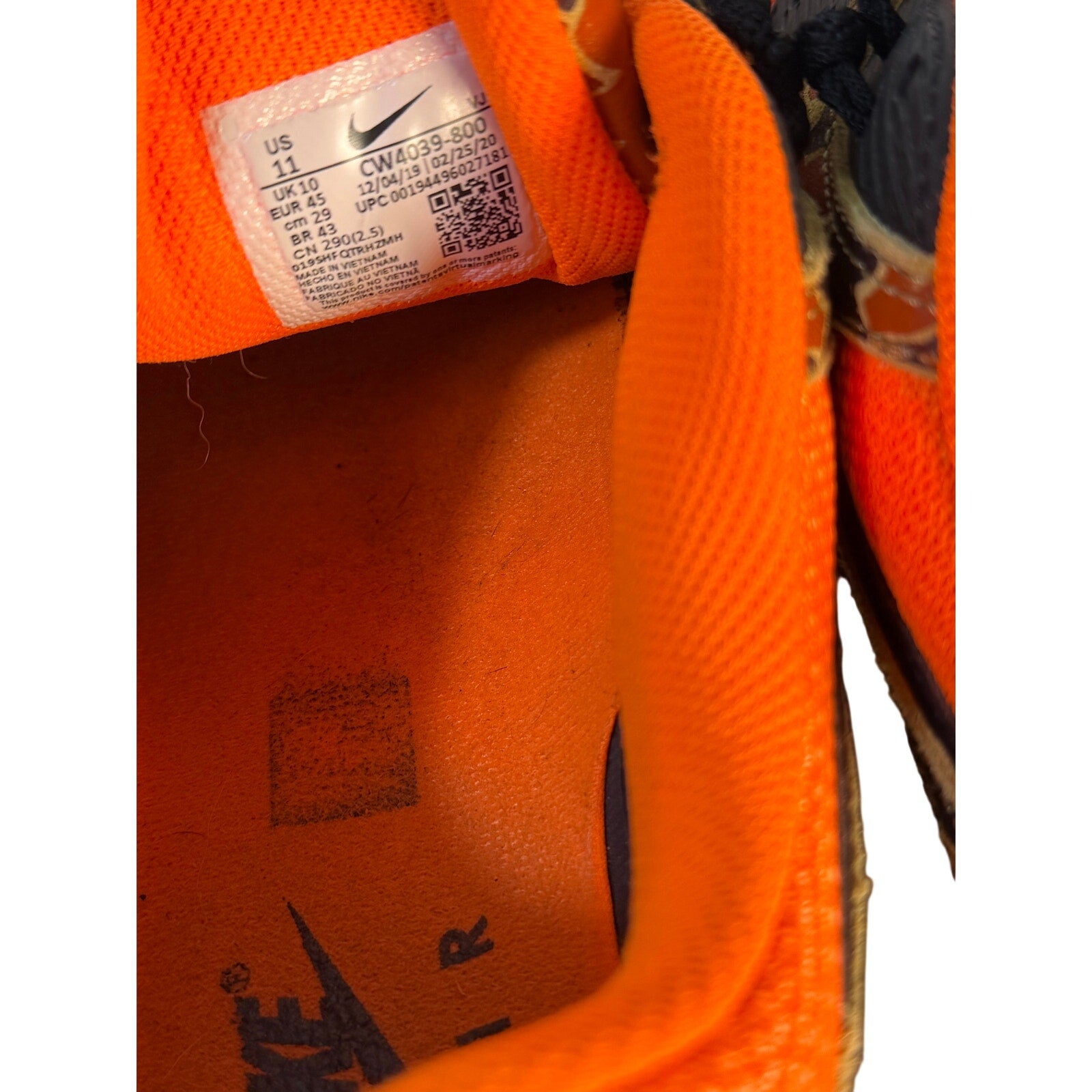 Nike Air Max 90 orange camo black sneakers for men, size 11, featuring a bold camo pattern and classic athletic design.