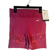 Nike Pro high-rise training shorts for women, large size, firm support, in berry color, designed for active workouts.