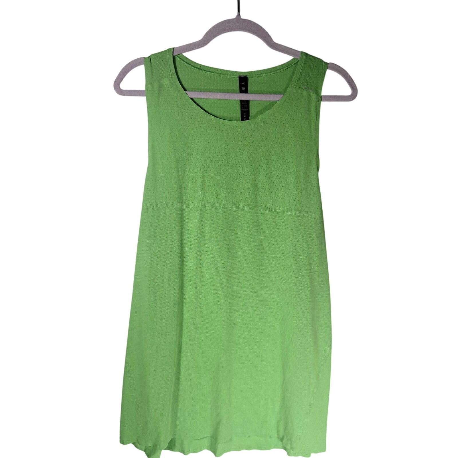 Lululemon women's lime green open-back athletic tank top, size XL, featuring a sleeveless design and breathable fabric.
