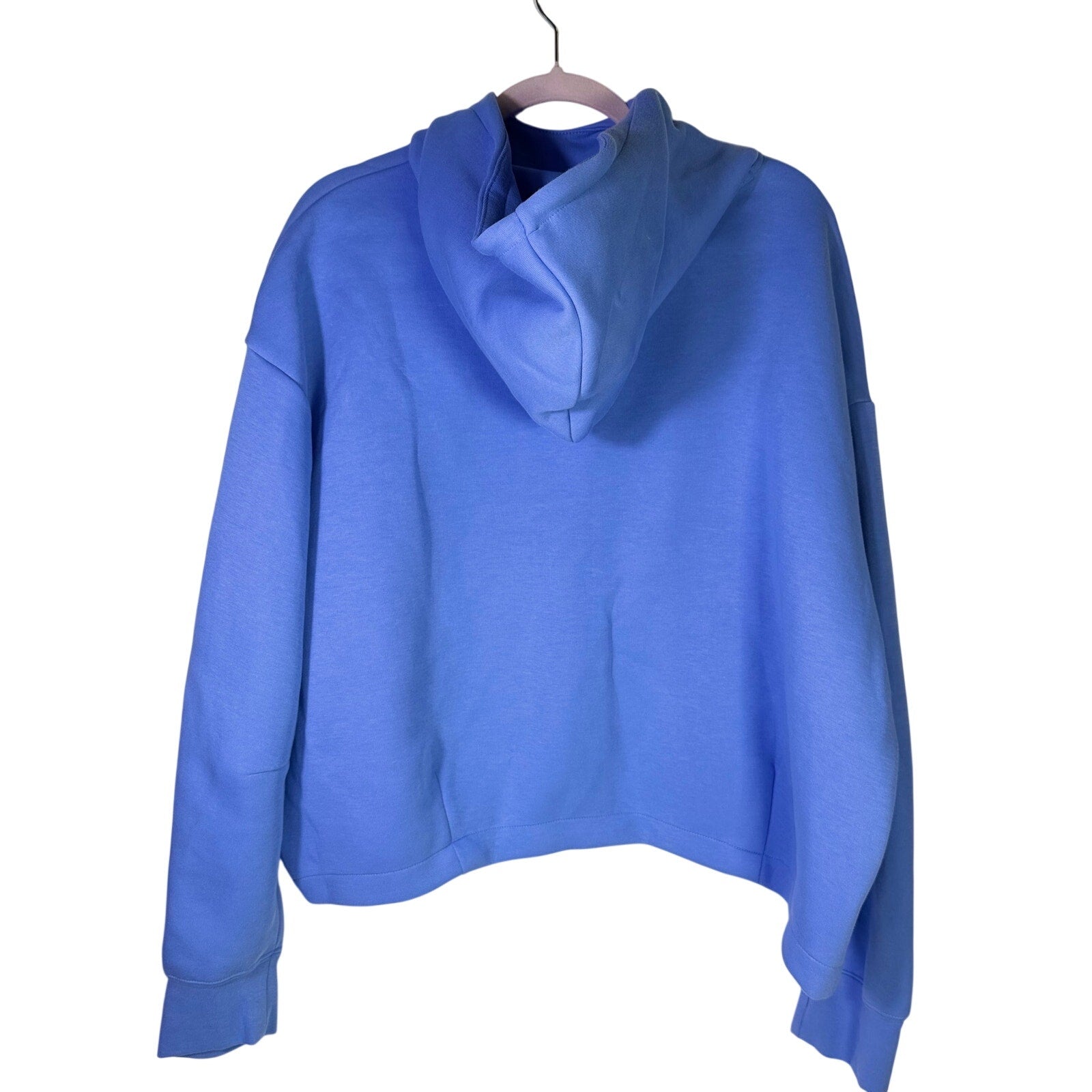 Nike Sportswear women's oversized blue fleece hoodie, size XL, front view showing soft fabric and relaxed fit.