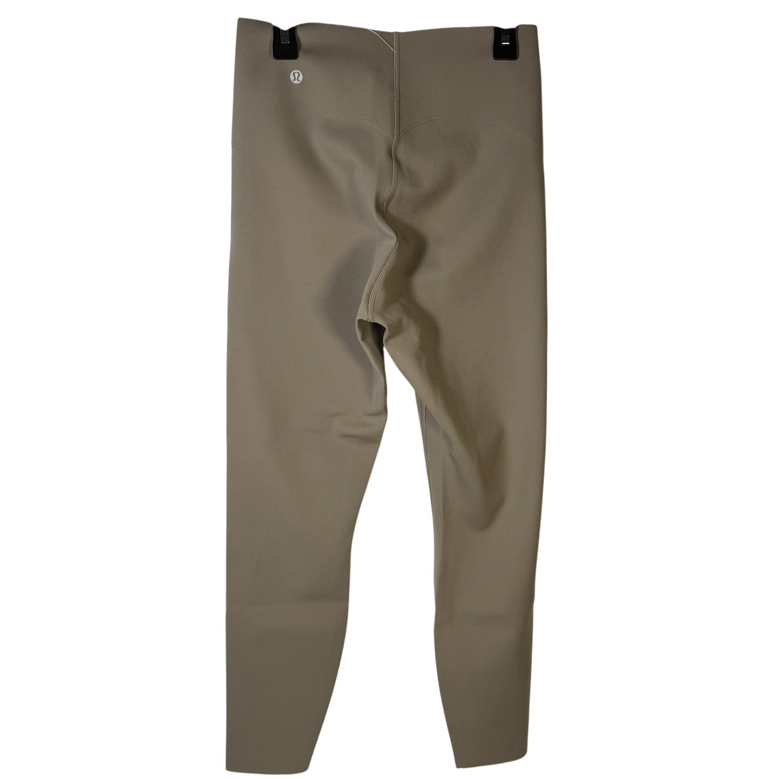 Lululemon Glow Up super-high-rise taupe gray leggings, size 4, showing the fitted design and comfortable stretch fabric.