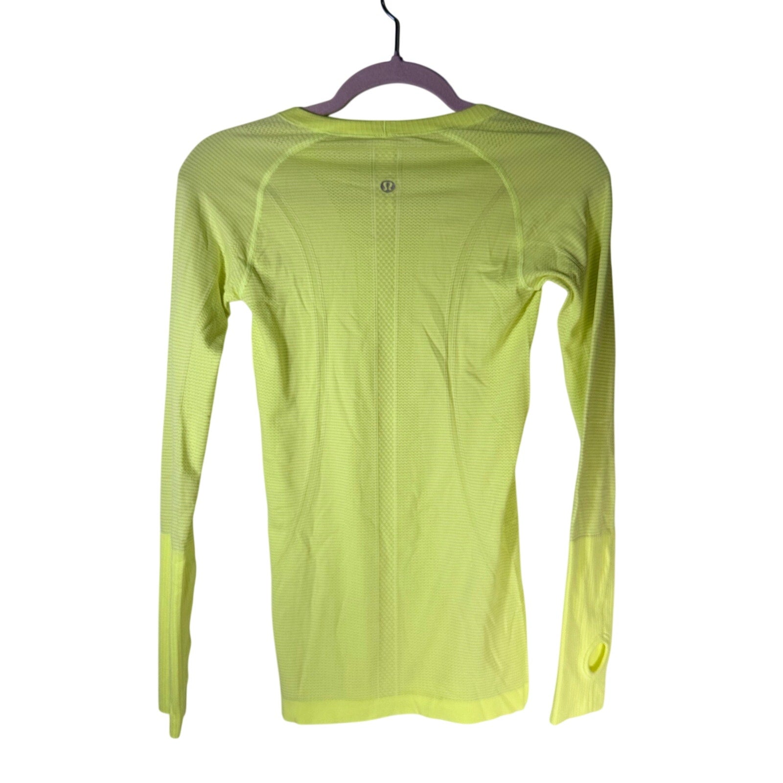 Lululemon Swiftly Tech long sleeve shirt for women, size 4, featuring lightweight, breathable fabric and a fitted athletic design.