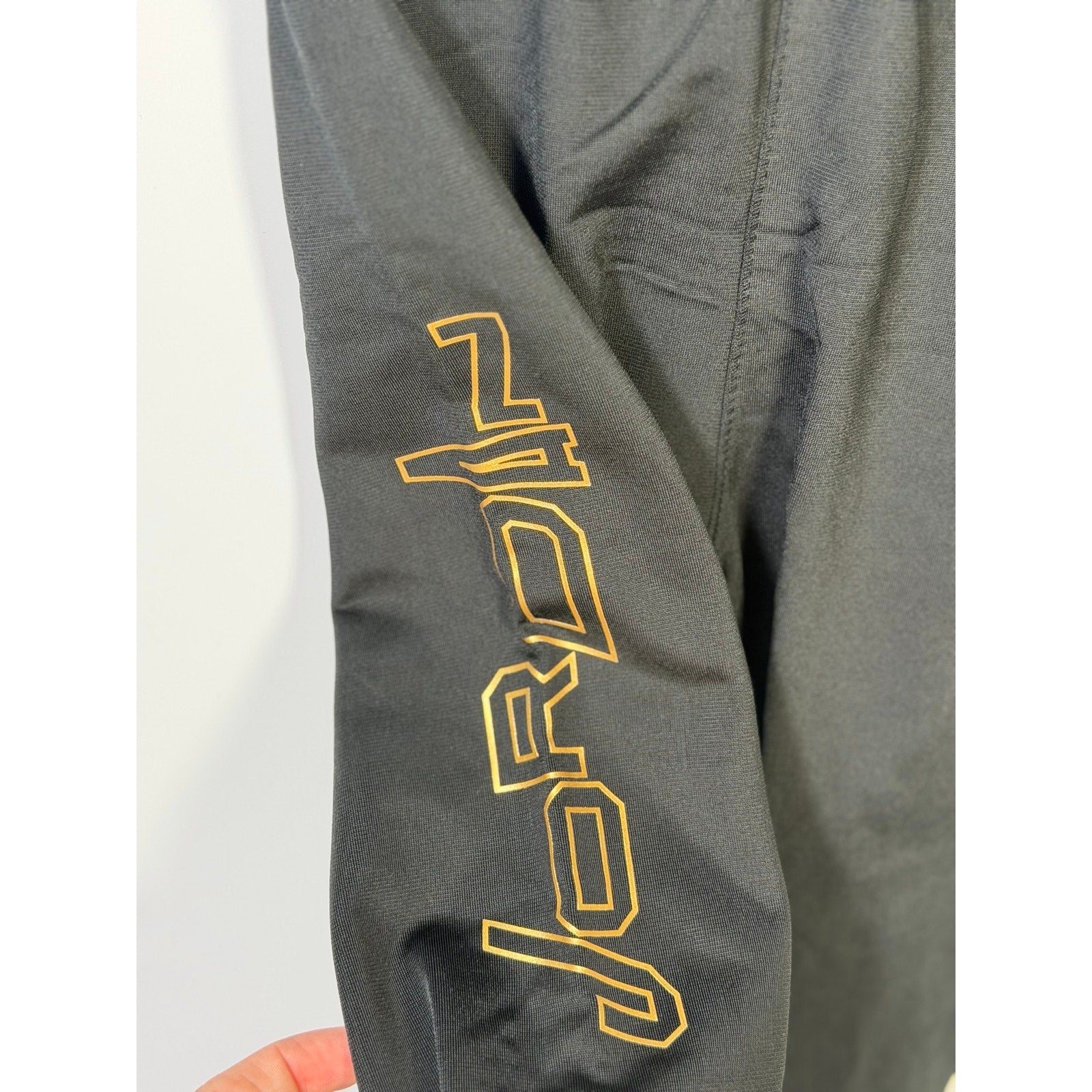 Jordan baby boys 2-piece black and gold track jacket and jogger set, size 18 months, showing jacket and pants with sporty design.