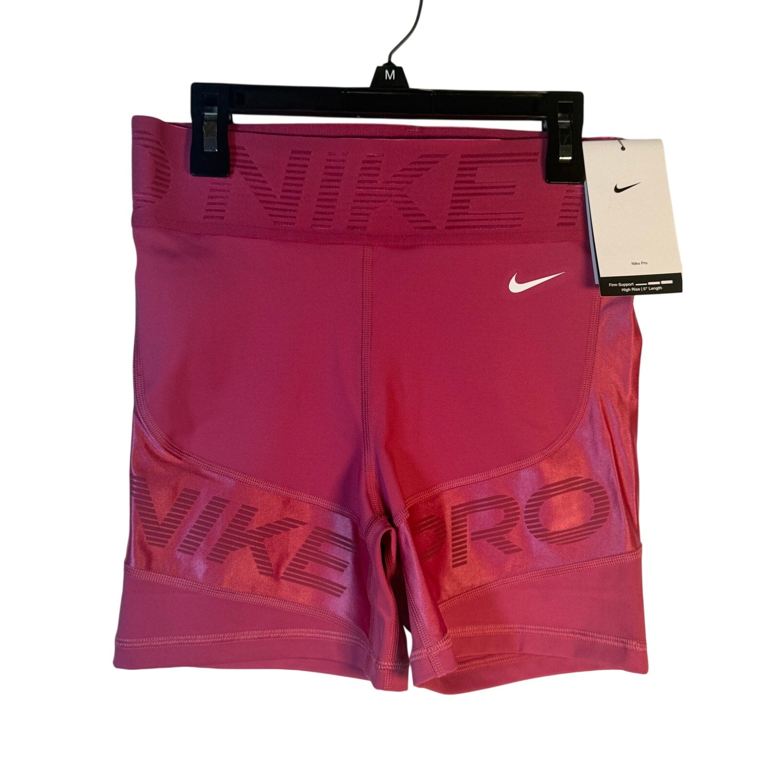 Nike Pro women's high rise 5-inch training shorts in Berry, featuring firm support and a snug fit, size small.