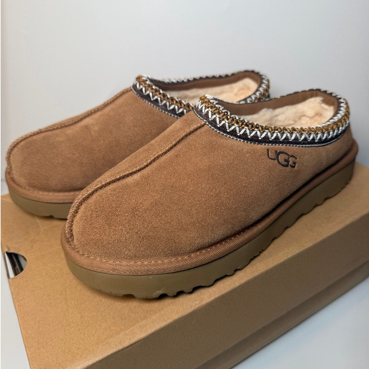 UGG Tasman II slippers for women in chestnut, size 9, featuring soft suede and plush lining for cozy comfort.