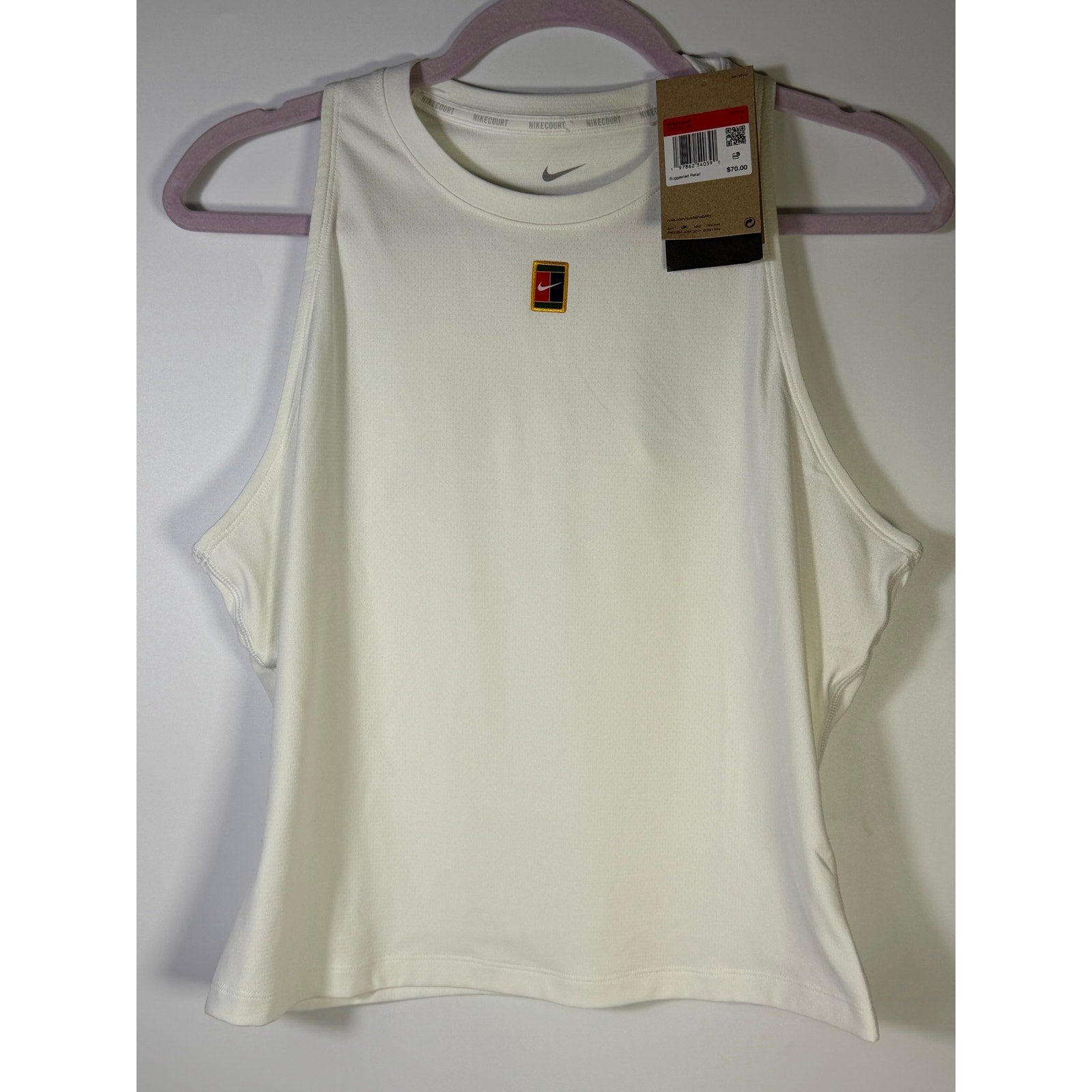 NikeCourt Women's Dri-FIT tennis tank top in white, size large, shown on a model with athletic fit and sleeveless design.