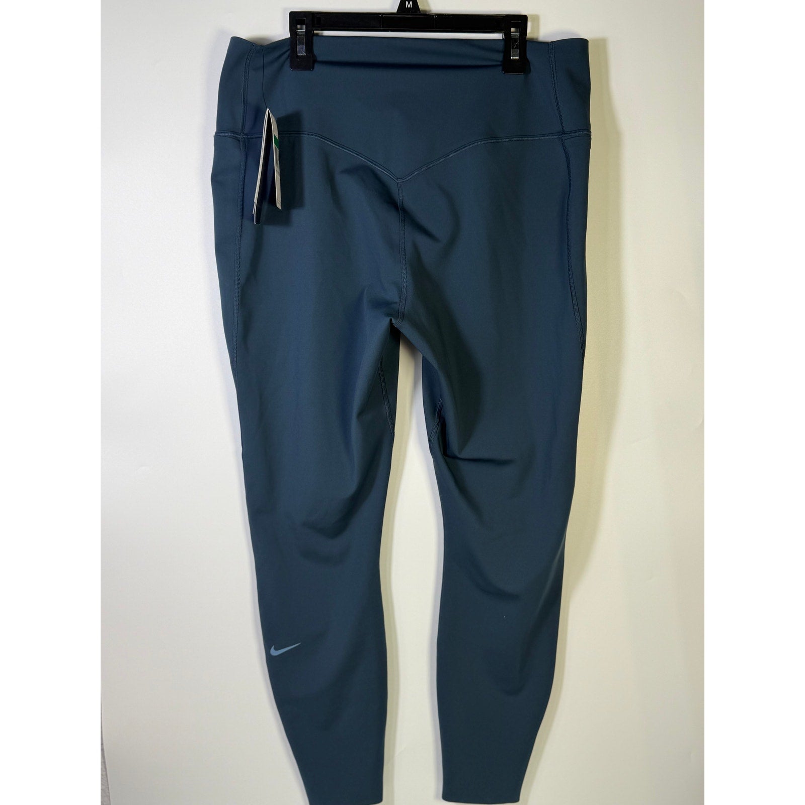 Nike women's high-waisted blue training leggings, XL size, stretchy and comfortable for active wear.
