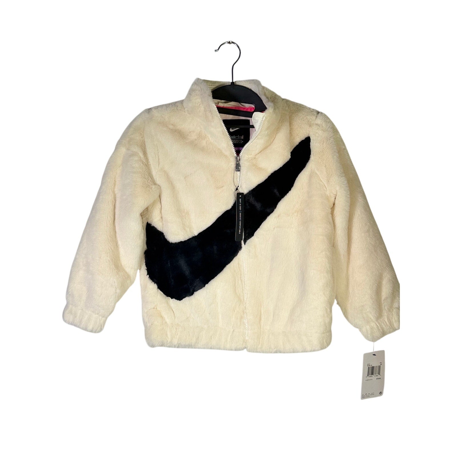 Nike girls' faux fur full zip jacket in cream and black with oversized swoosh, size 6X, featuring a cozy, stylish design.