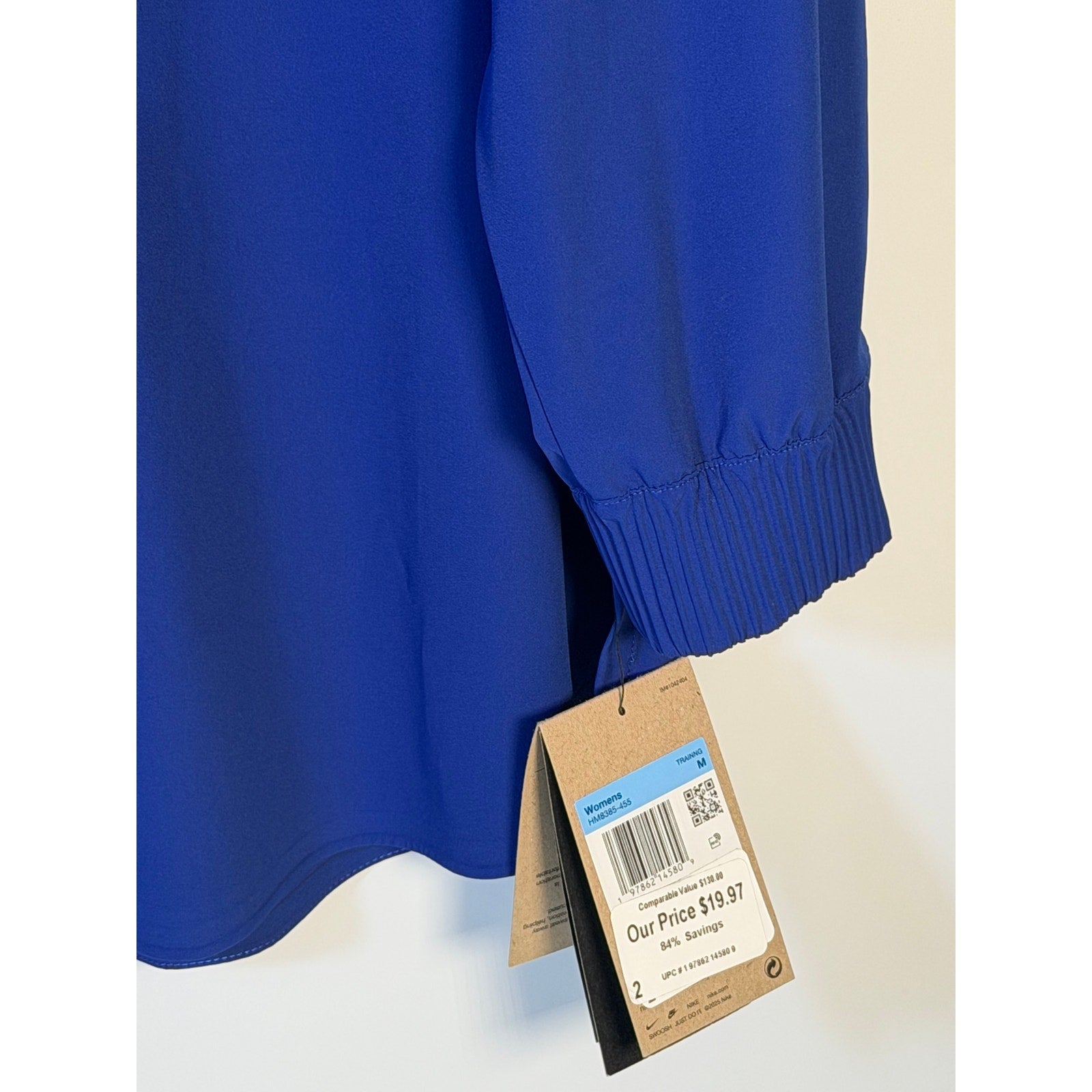 Nike 24.7 Women's Medium Blue Dri-FIT training button-front shirt, casual athletic top with short sleeves and front button closure.