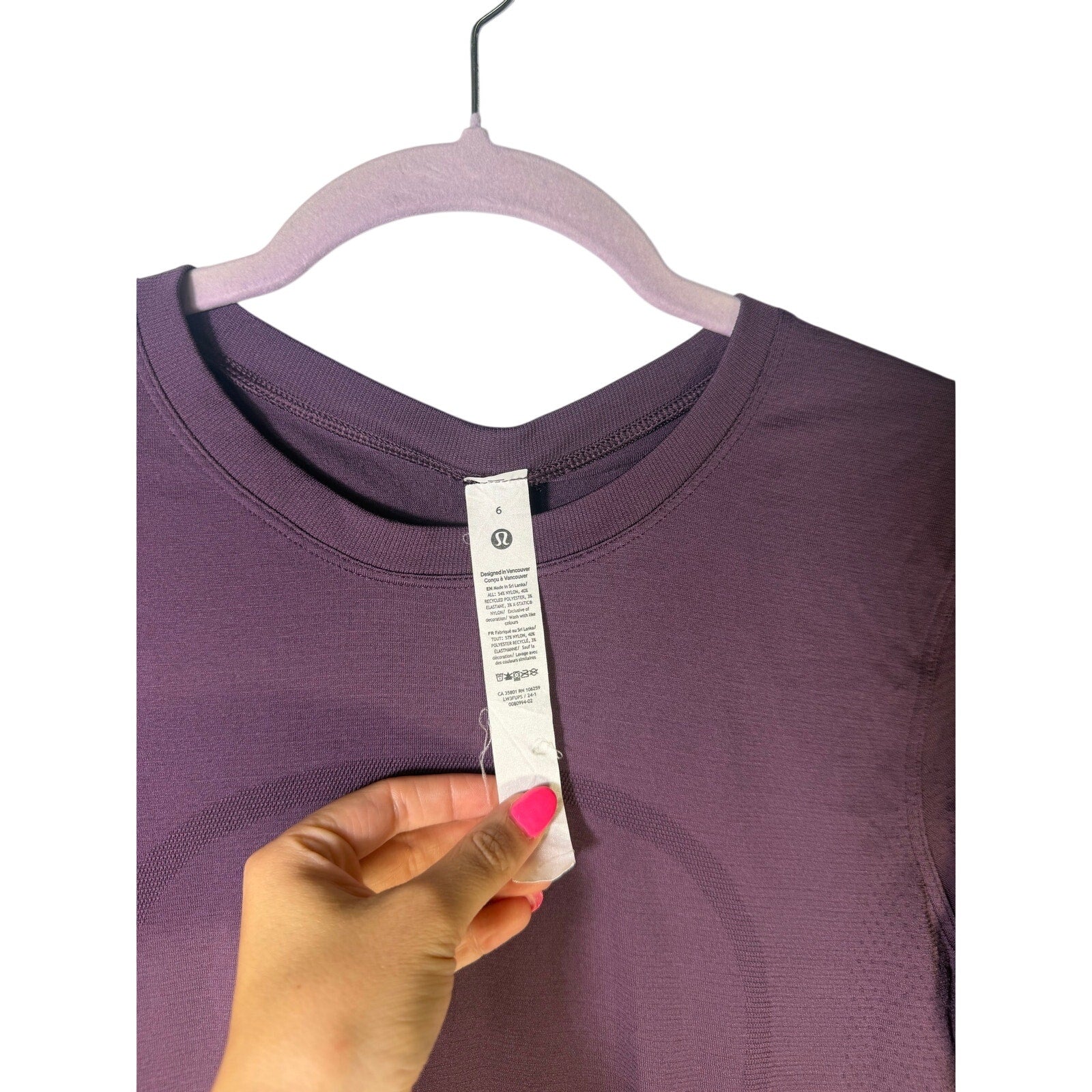 Lululemon women’s purple Swiftly Tech long-sleeve athletic shirt, size 6, made of lightweight, breathable performance fabric.