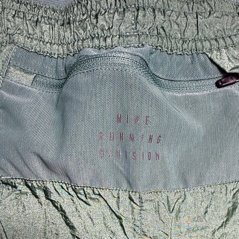 Nike Running Division Stride 5" Dri-FIT men's shorts in small, lightweight fabric with Nike logo and adjustable waistband.