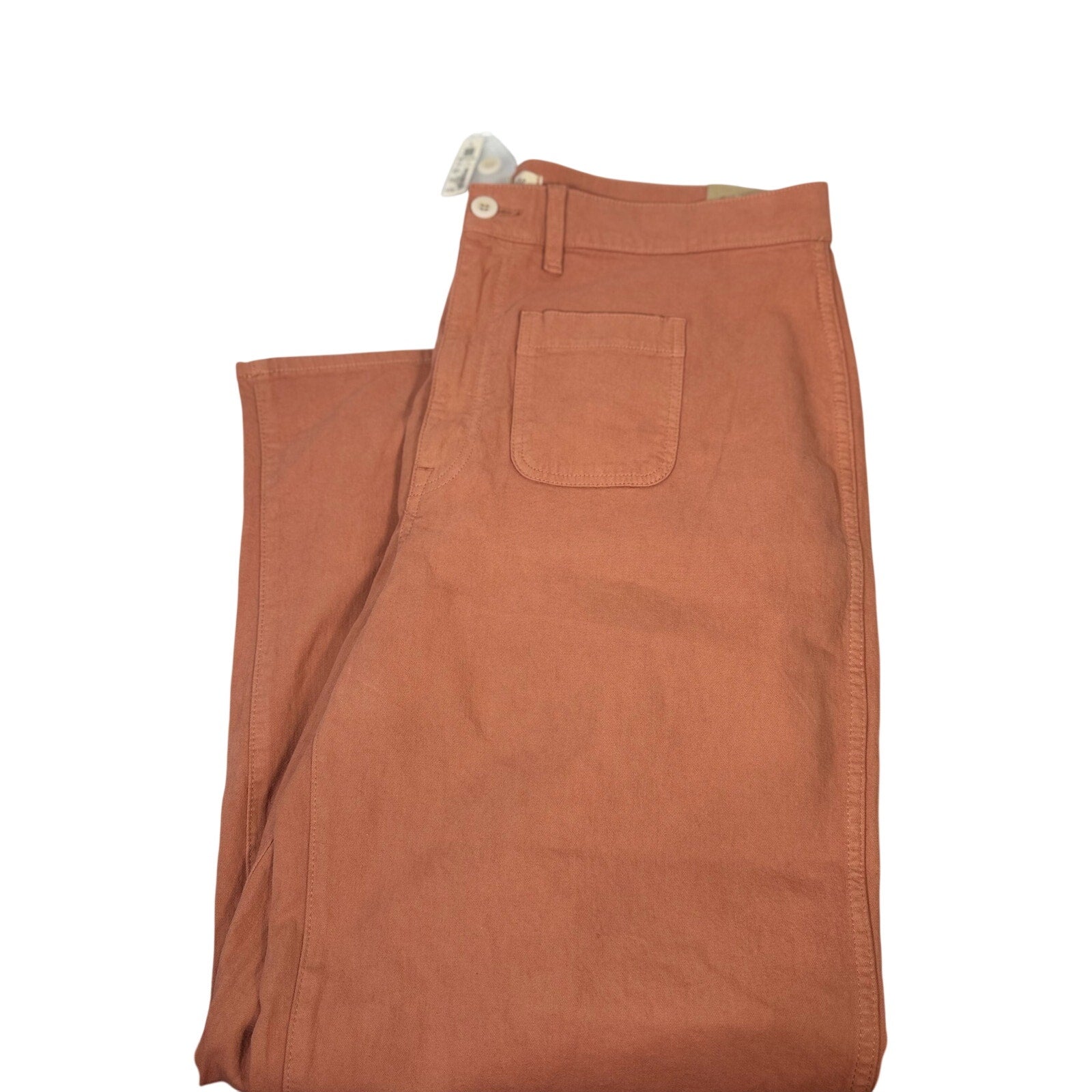 Madewell The Perfect Vintage wide-leg crop pants in terracotta, size 33, displayed on a hanger with a plain background.