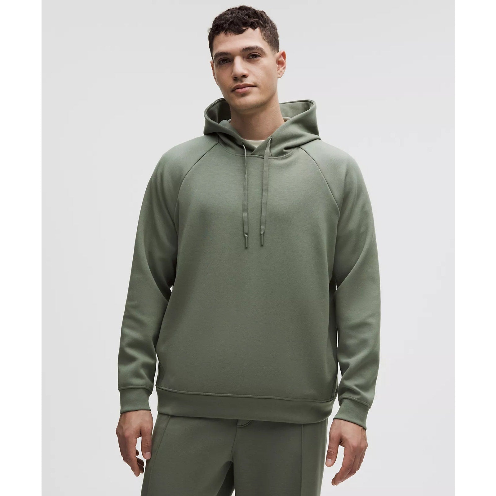 Men's green Lululemon Smooth Spacer pullover hoodie with a relaxed fit and soft fabric, shown on a plain background.
