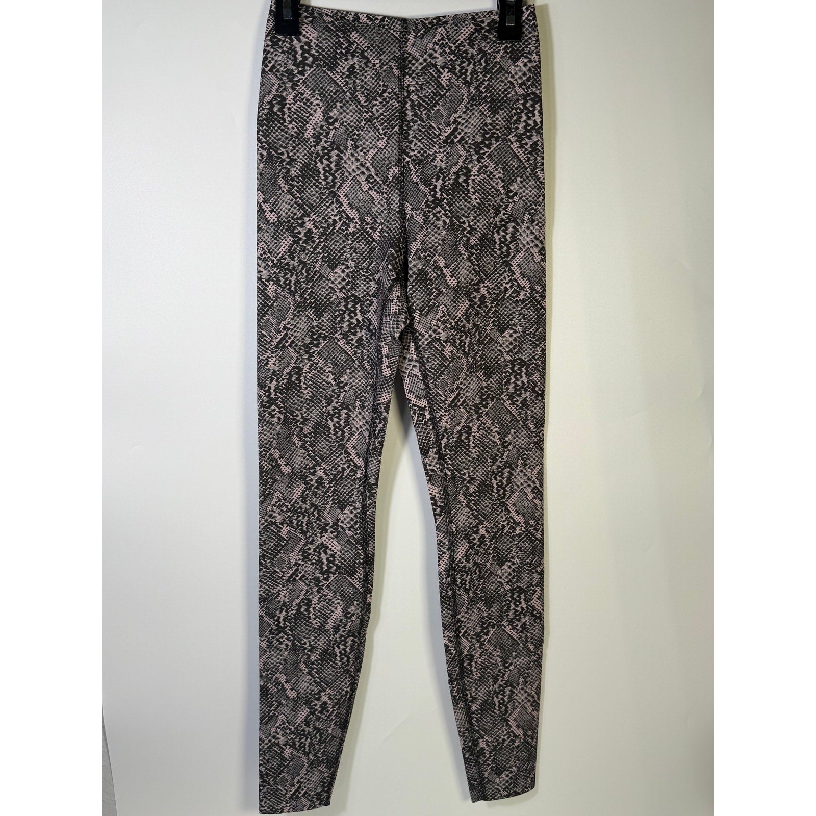 Lululemon Glow Up SHR Tight leggings in pink and black snakeskin pattern, size 4, showing the high-waisted design and tapered fit.