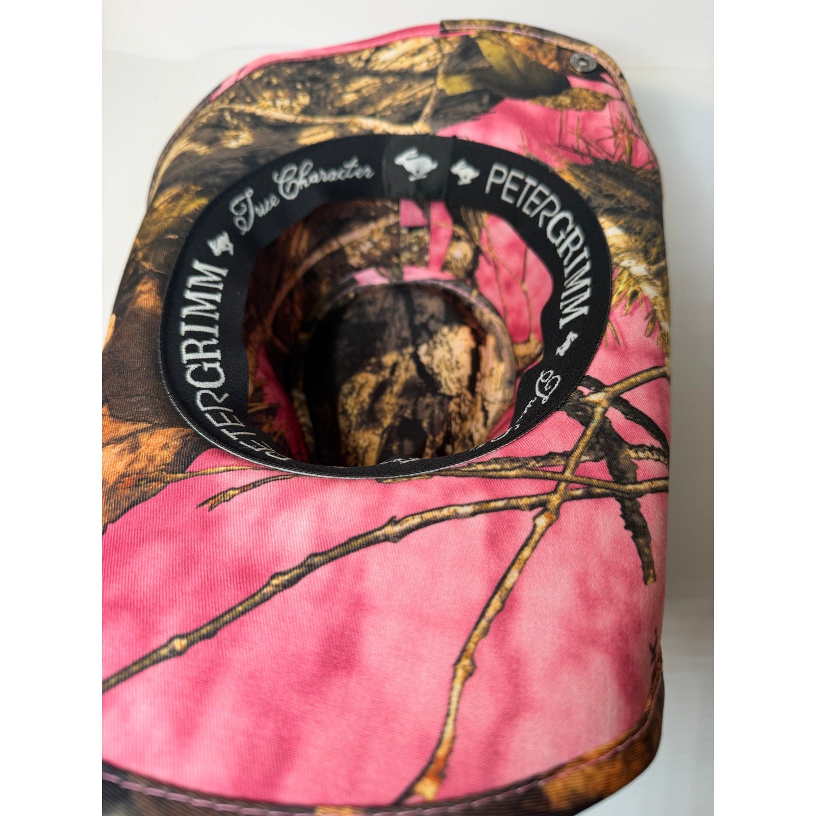 Peter Grimm Mossy Oak pink camo women’s western cowboy hat with snap-up brim and western-style design.