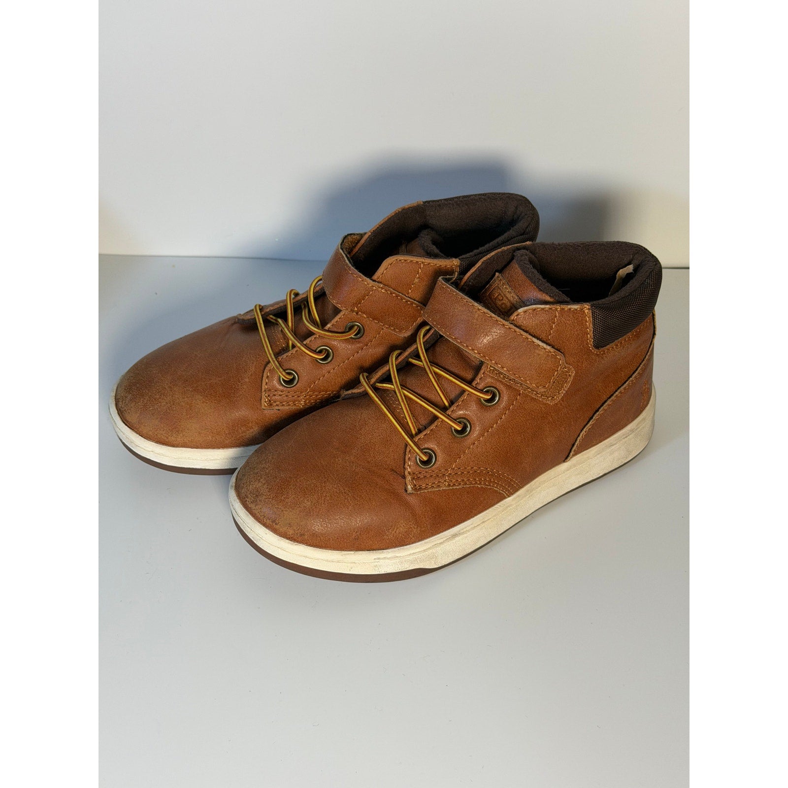 Pre-owned Polo Ralph Lauren kids' brown mid-top sneakers with hook-and-loop fasteners, US size 13C, shown from the side.