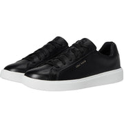 Women's Cole Haan Grand Crosscourt Daily sneaker in size 7.5B, featuring a sleek design with white and neutral tones.