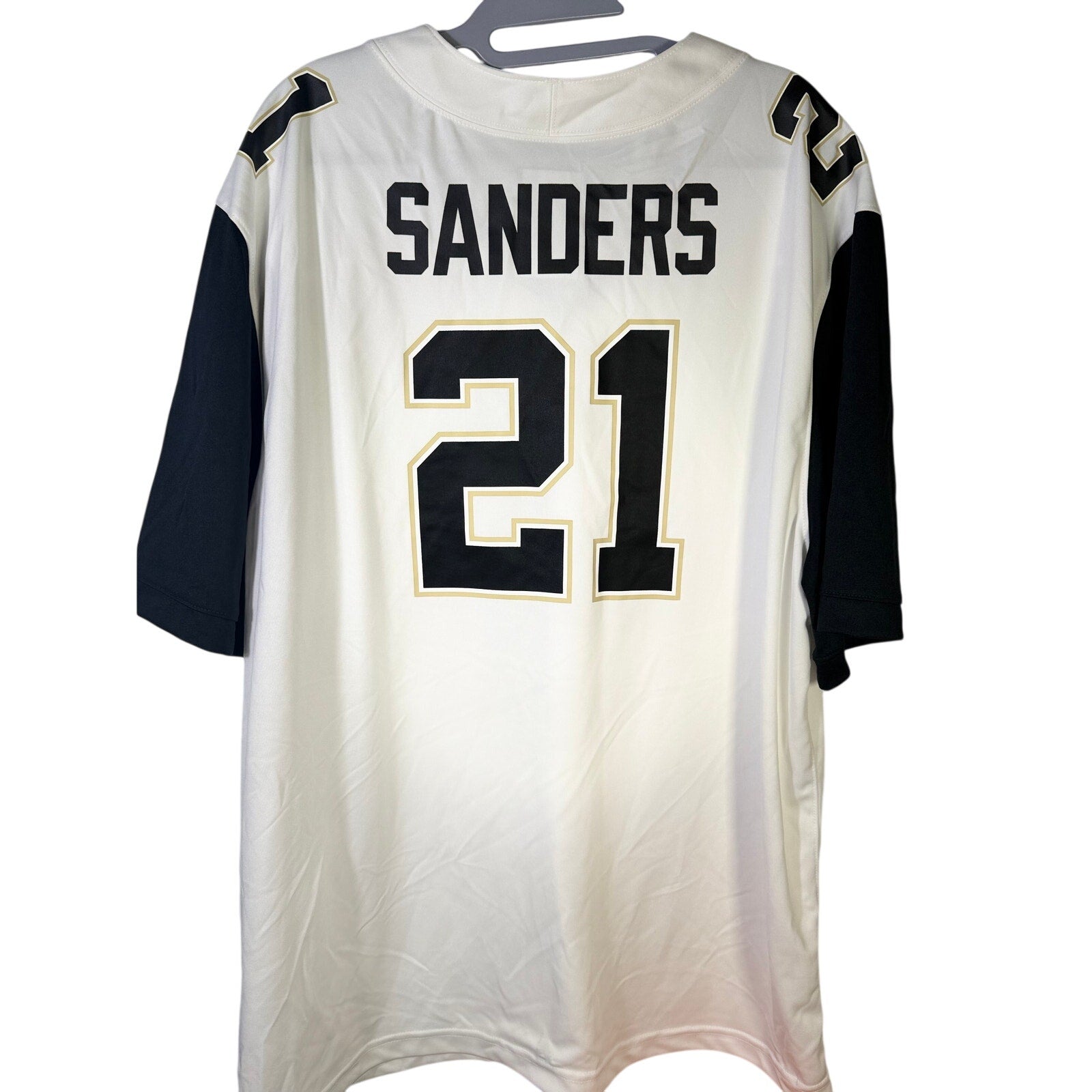 Nike PRIME Deion Sanders #21 football jersey in white, men's 2XL size, featuring team and brand logos on the front.