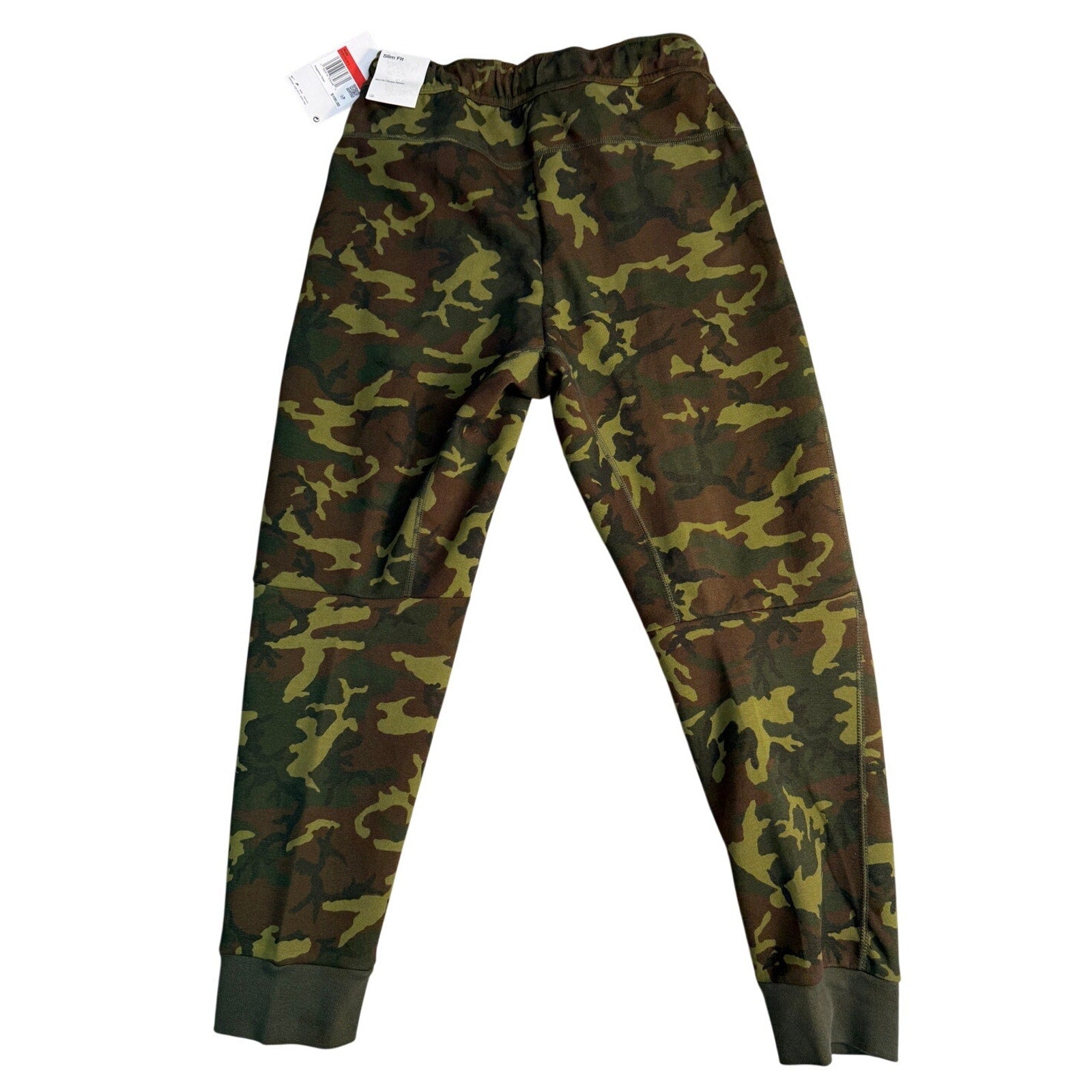 Nike Sportswear Tech Camo joggers in youth size medium, featuring a camo pattern and sporty design, made of comfortable pants.
