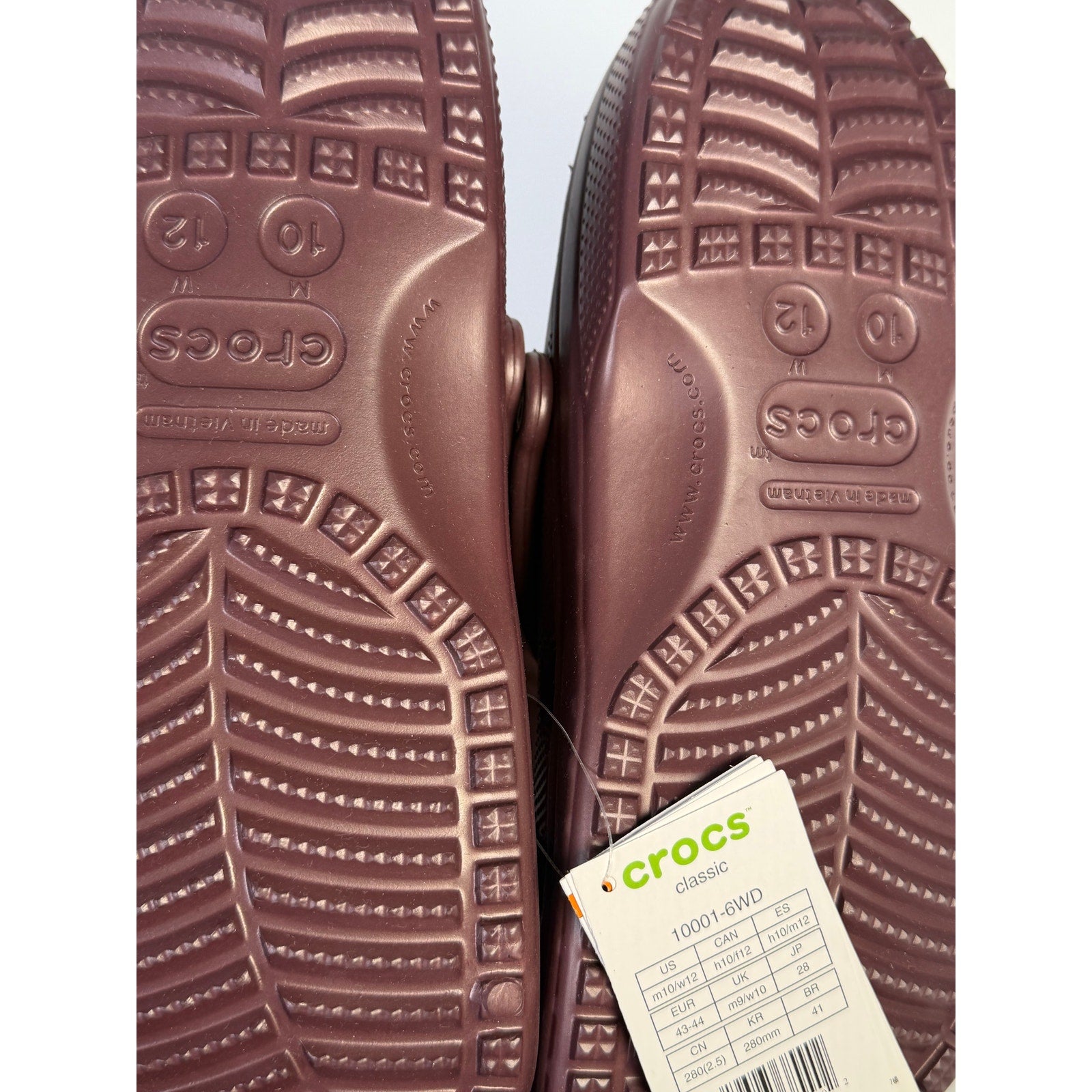 Burgundy Crocs Classic Clogs for men and women, slip-on comfort shoes with a unisex design, featuring the iconic Crocs style.