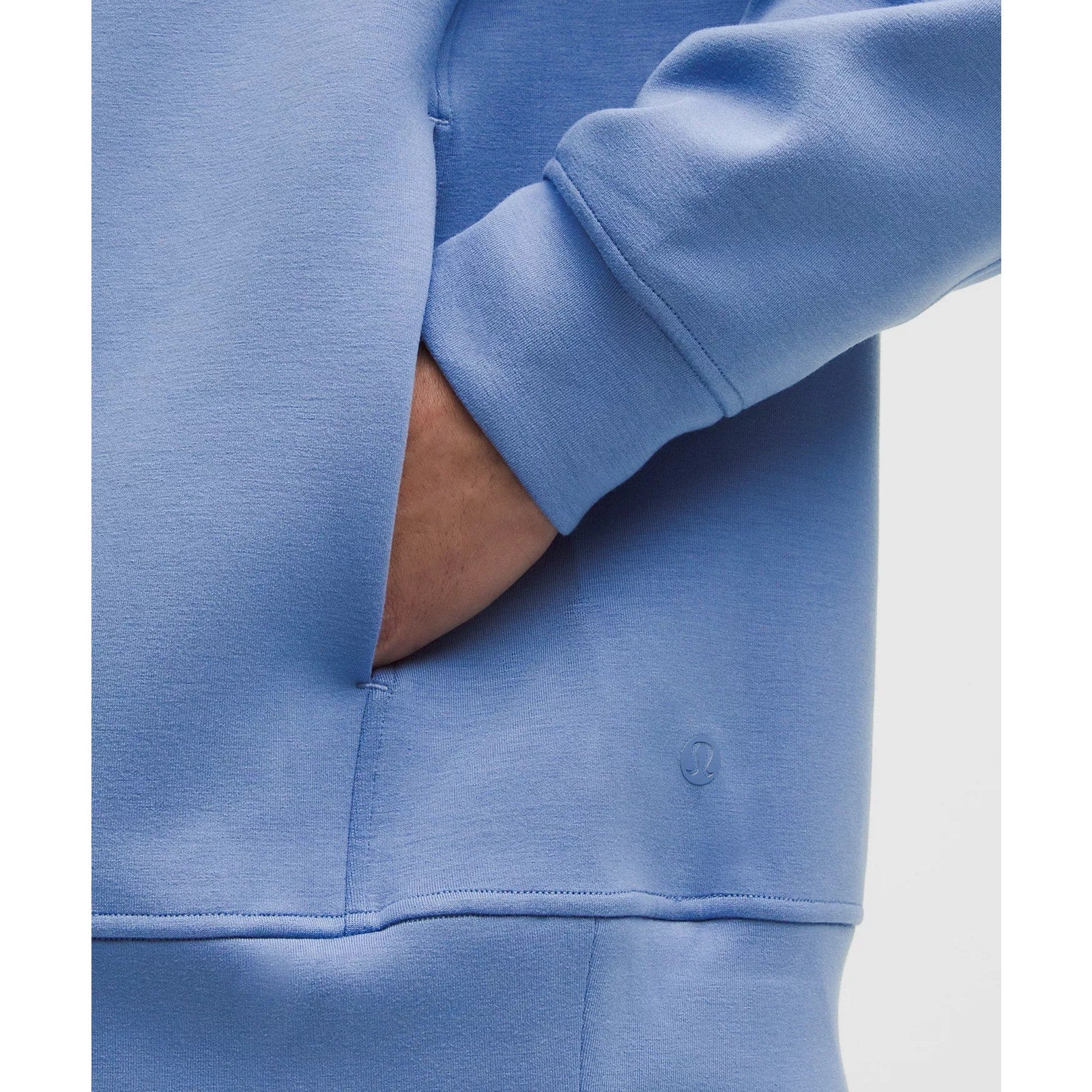 Men's Lululemon Smooth Spacer Pullover Hoodie in blue, showing the soft fabric and relaxed fit on a mannequin.