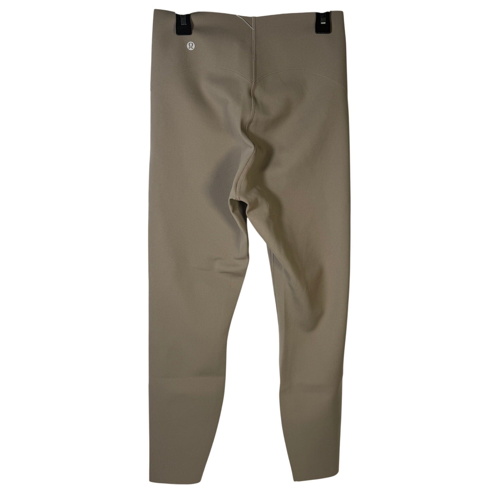 Lululemon Glow Up super-high-rise taupe gray leggings, size 4, with a snug fit and smooth fabric, shown on a model.