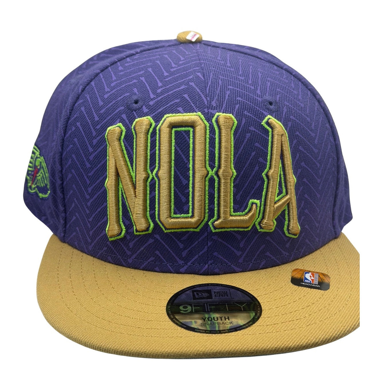 New Era NOLA Pelicans 9FIFTY youth snapback hat in purple and gold with NBA team logo, adjustable brim and flat top style.
