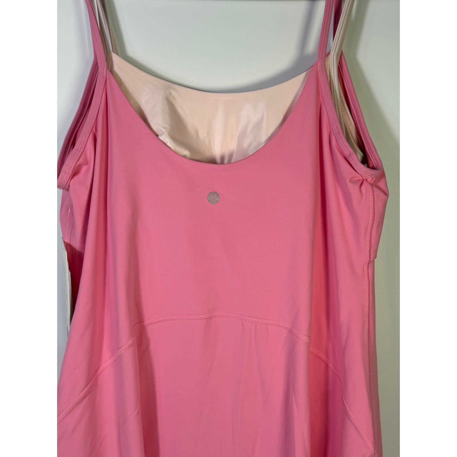 Pink Lululemon Align layered dress with built-in bra for women, size 14, made from Nulu fabric, displayed on a hanger.