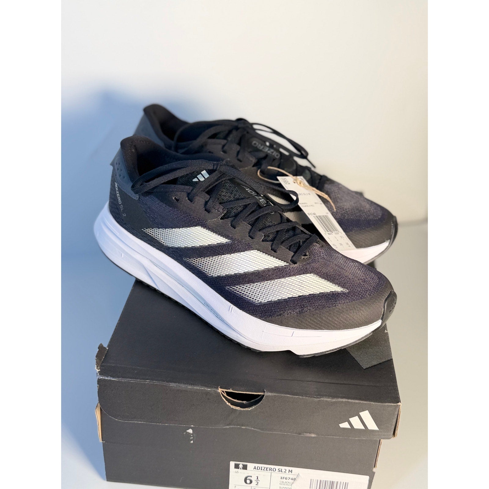 Men's Adidas Adizero SL2 athletic running shoes in black and white with Lightstrike cushioning, size 6.5, new.